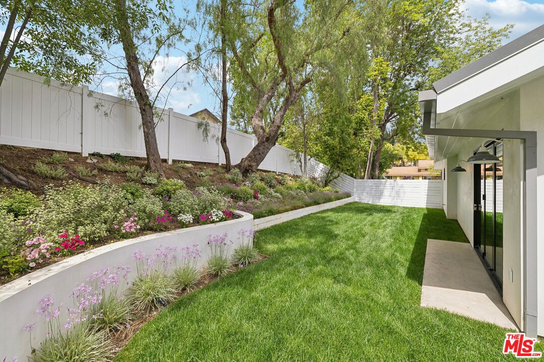 5565 Jed Smith Road Hidden Hills, CA 91302 - Photo 33 of 46 a front view of a house with a yard