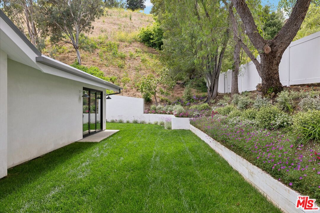5565 Jed Smith Road Hidden Hills, CA 91302 - Photo 34 of 46 a backyard of a house with lots of green space