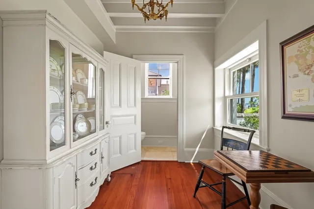 a view of a livingroom with furniture window and wooden floor
