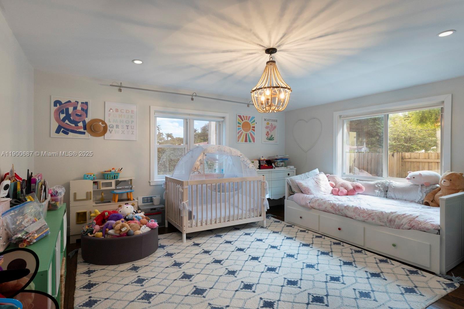 1200 Southwest 18th Street Miami, FL 33145 - Photo 18 of 36 a bedroom with furniture and a chandelier