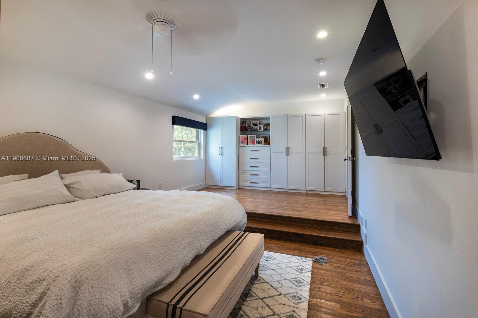 1200 Southwest 18th Street Miami, FL 33145 - Photo 19 of 36 a bedroom with a bed a flat screen tv and a couch