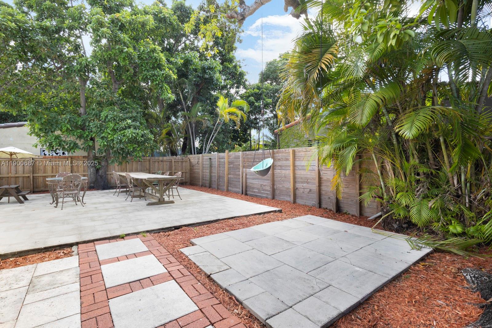 1200 Southwest 18th Street Miami, FL 33145 - Photo 25 of 36 a backyard of a house with seating space