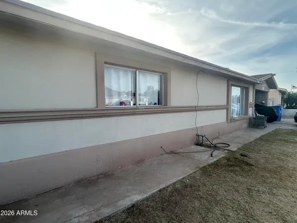 a view of a room with gym equipment and a window
