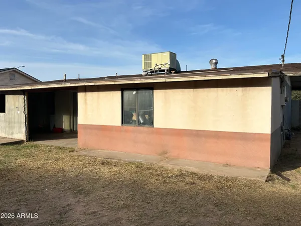 a view of a back yard from a big room