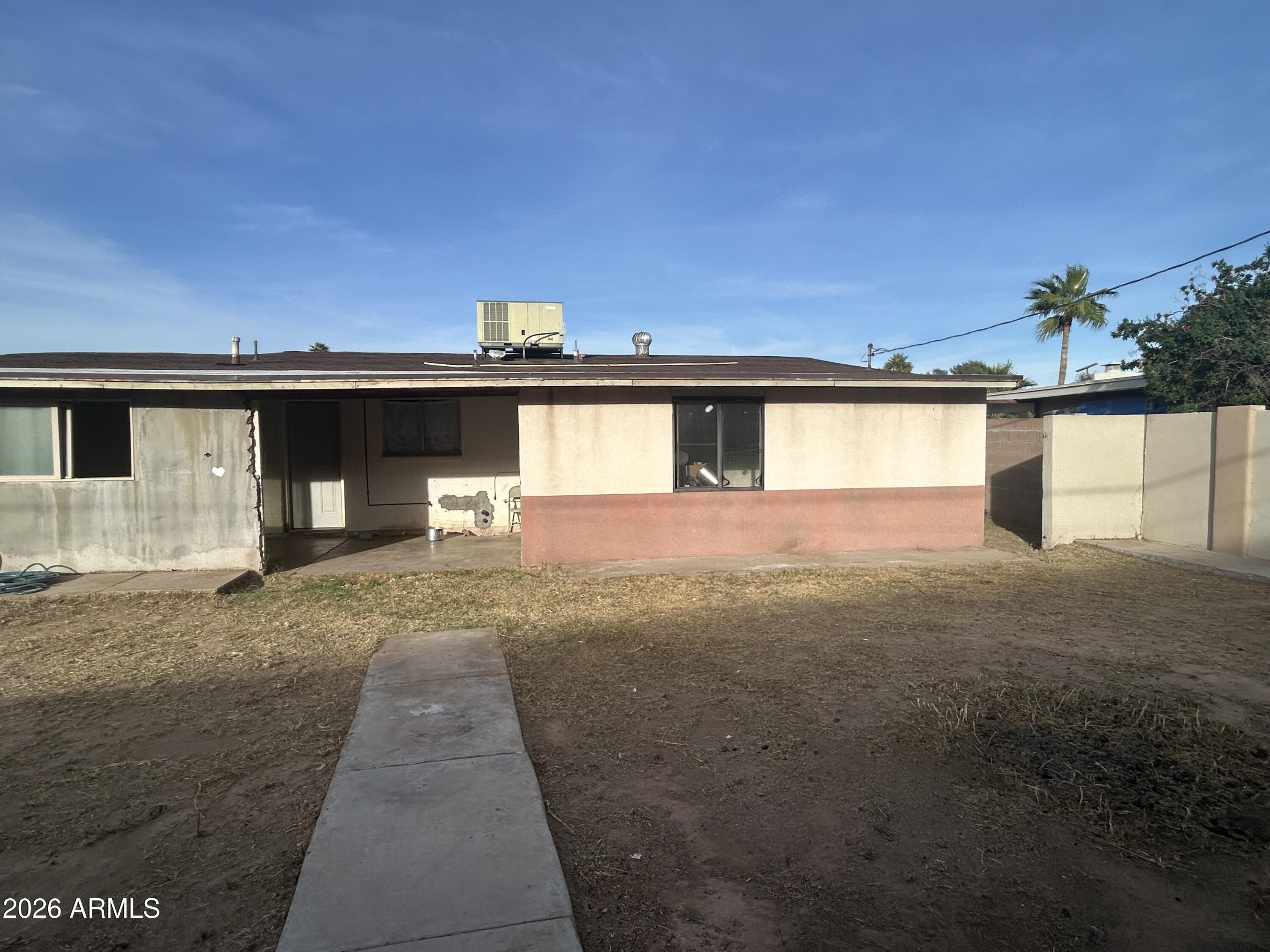 12410 North Escobar Way Phoenix, AZ 85022 - Photo 14 of 20 a front view of a house with a yard