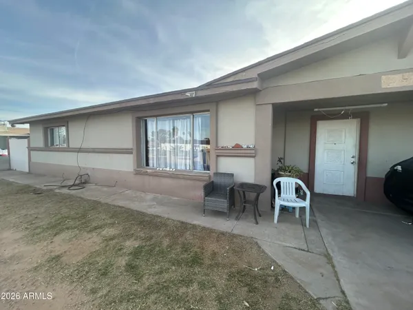 a view of a livingroom with furniture and windows