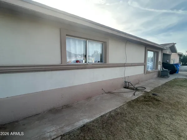 a living room with a table and chairs