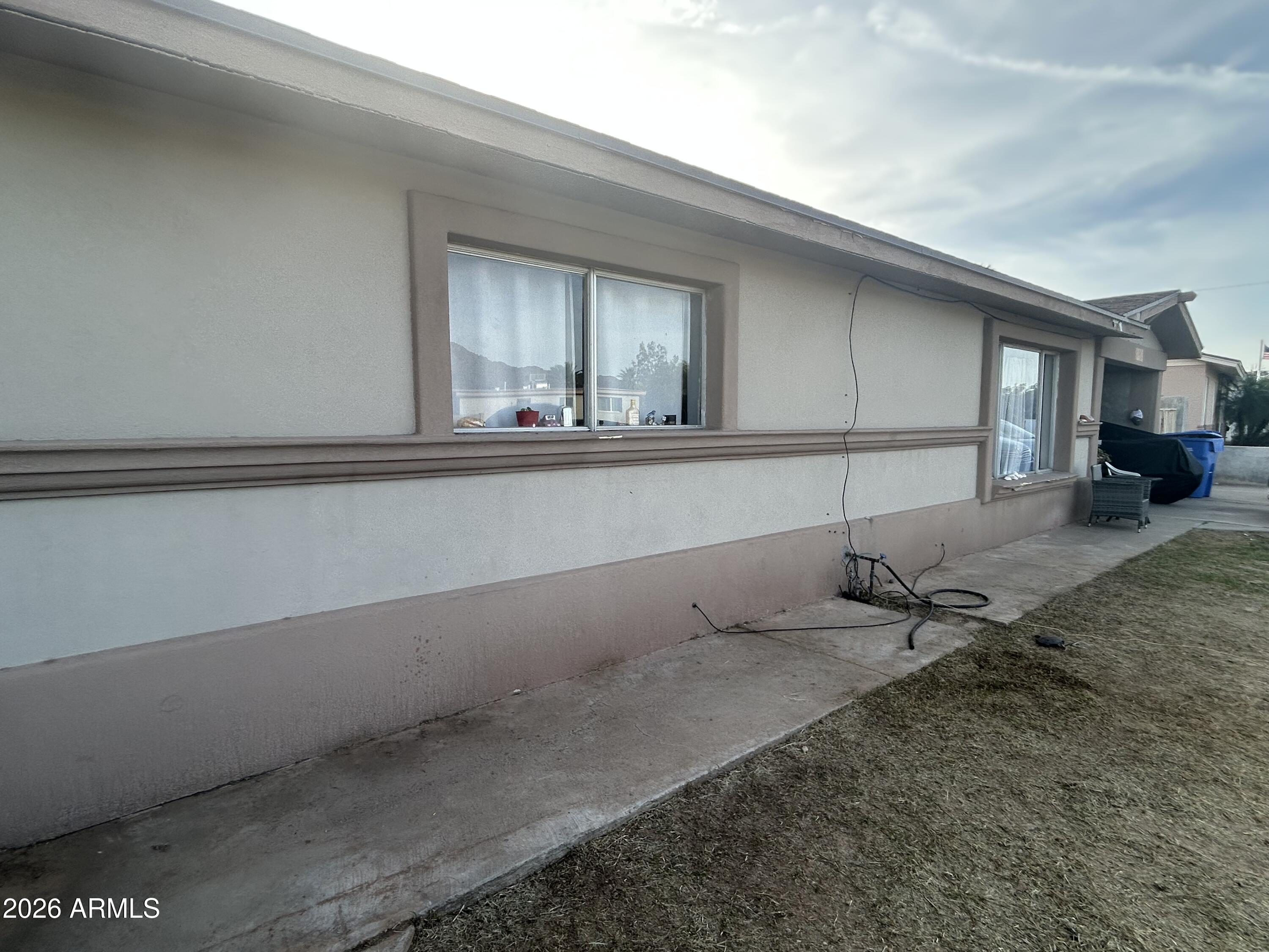 12410 North Escobar Way Phoenix, AZ 85022 - Photo 4 of 20 a living room with a table and chairs
