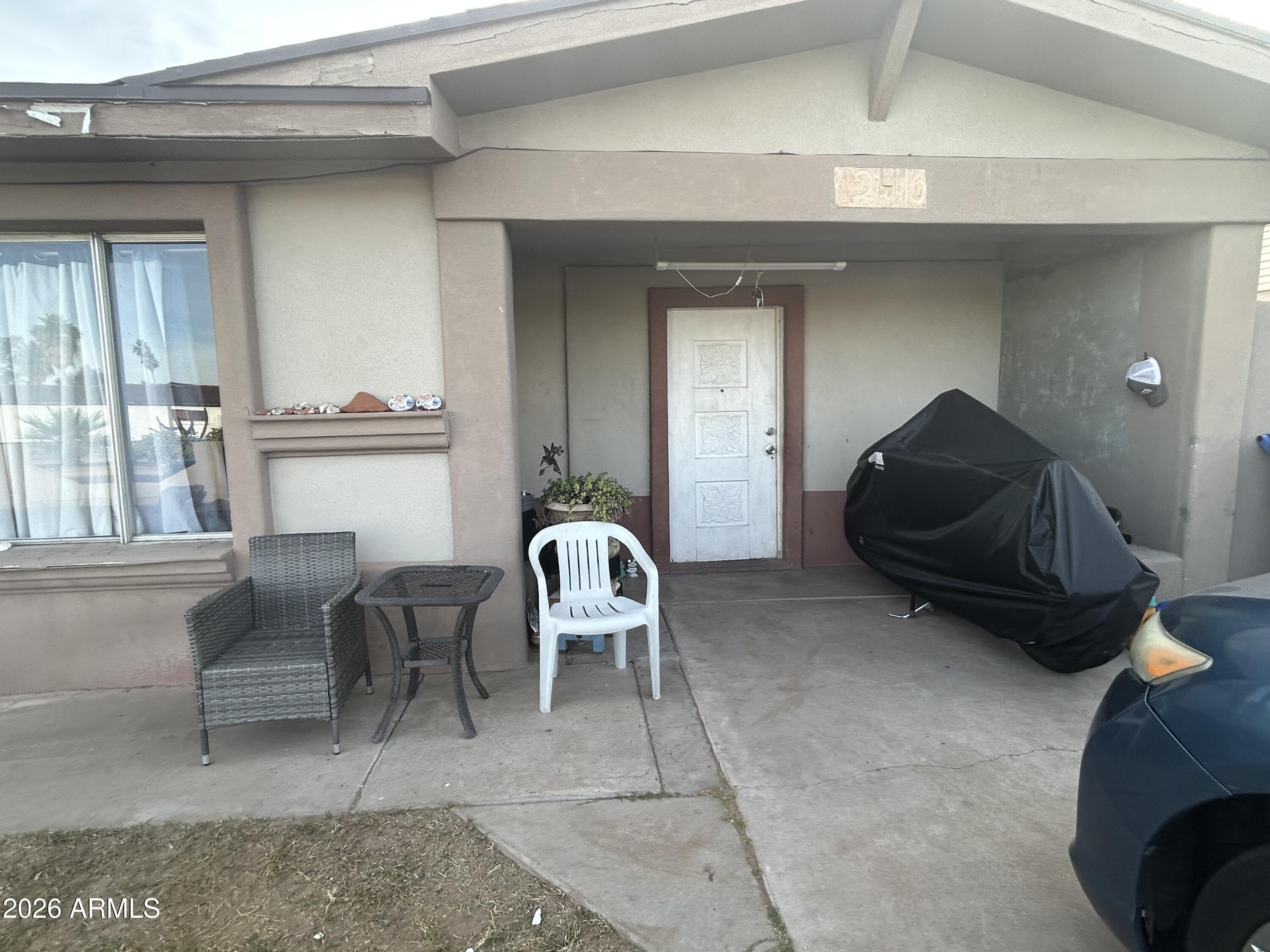 12410 North Escobar Way Phoenix, AZ 85022 - Photo 6 of 20 a living room with furniture and a window