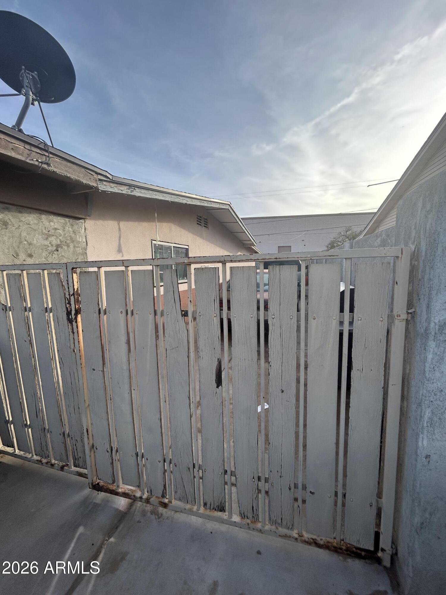 12410 North Escobar Way Phoenix, AZ 85022 - Photo 7 of 20 a view of a garage with wooden walls