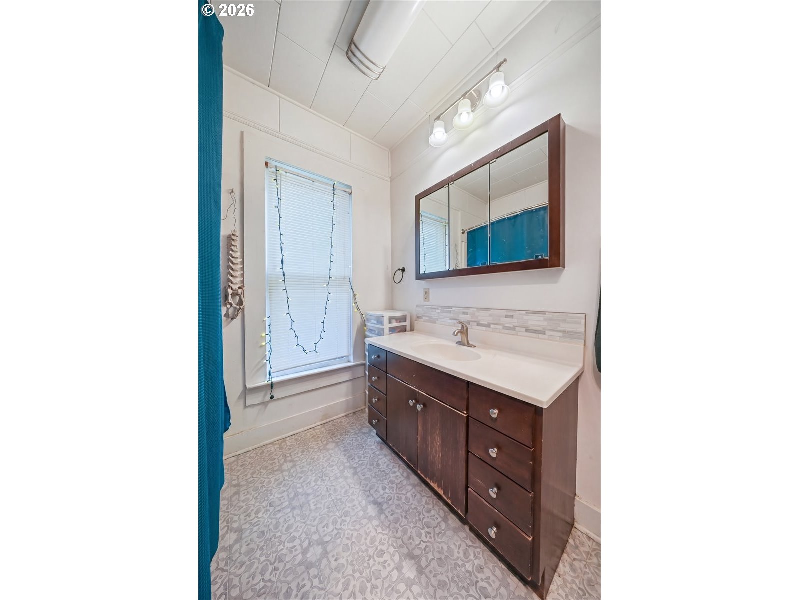740 South 6th Street Cottage Grove, OR 97424 - Photo 20 of 21 a bathroom with a sink and a mirror