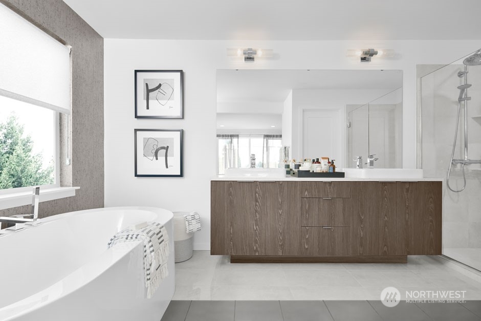 4008 213th Street Southeast Bothell, WA 98021 - Photo 14 of 14 a bathroom with a tub sink and mirror