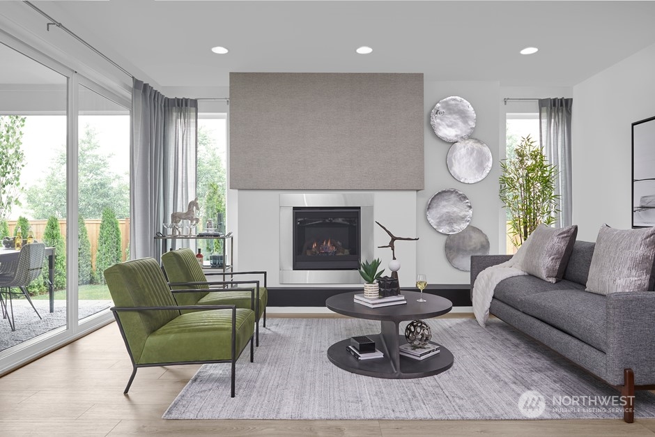 4008 213th Street Southeast Bothell, WA 98021 - Photo 5 of 14 a living room with furniture a fireplace a large window and a large window