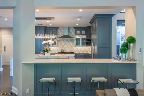 a kitchen with a table and chairs in it