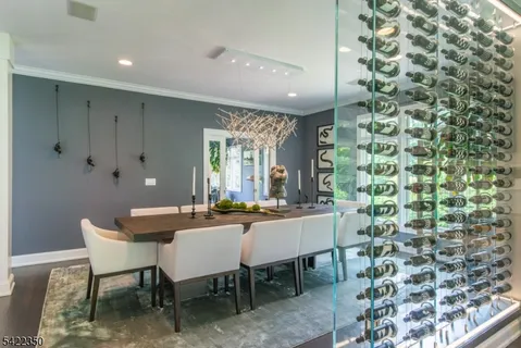 a dining room with a table and chairs