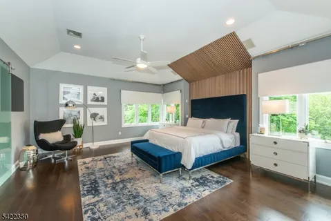 a spacious bedroom with a large bed and a window