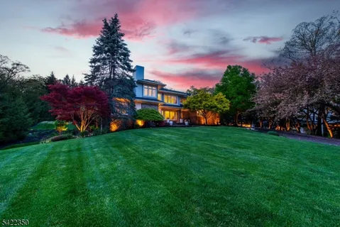 a view of a garden with a house