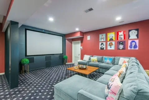 a living room with furniture and a rug
