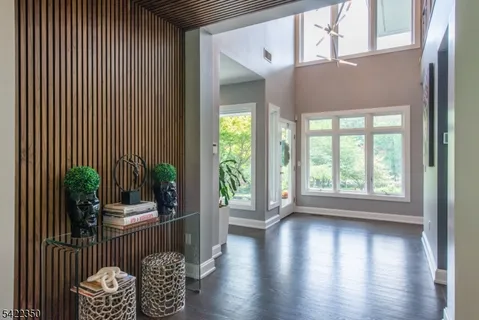 a view of an entryway with wooden floor