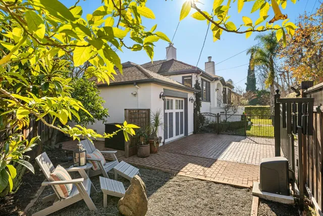 a view of outdoor sitting area with furniture and garden