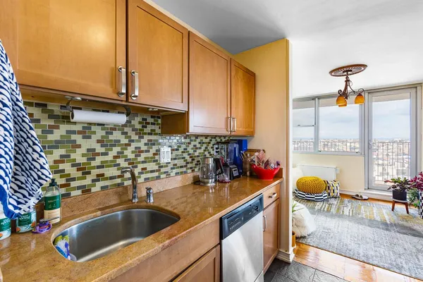 a kitchen with a sink and a window