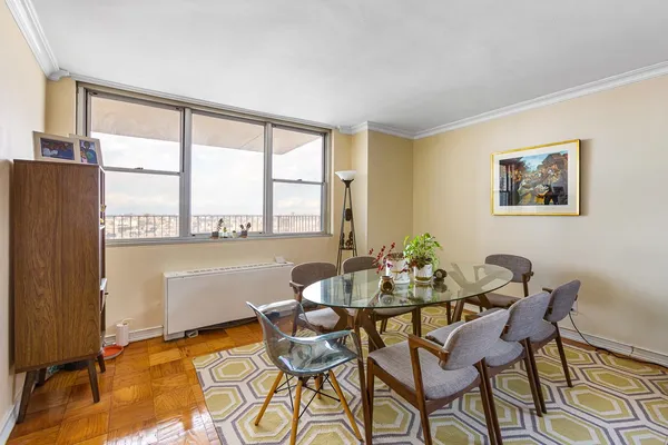 a dining room with furniture and window