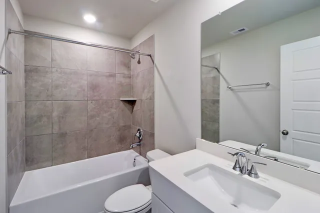 a bathroom with a sink toilet and bathtub