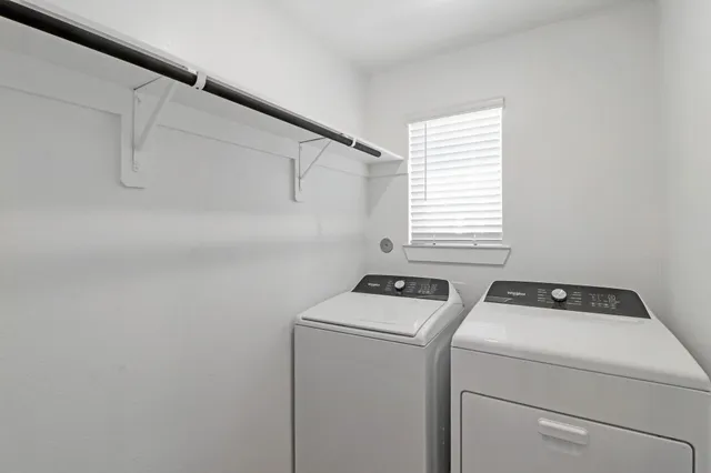 a room with storage and washer