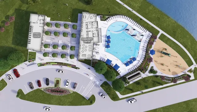 an aerial view of a house with a swimming pool and outdoor seating