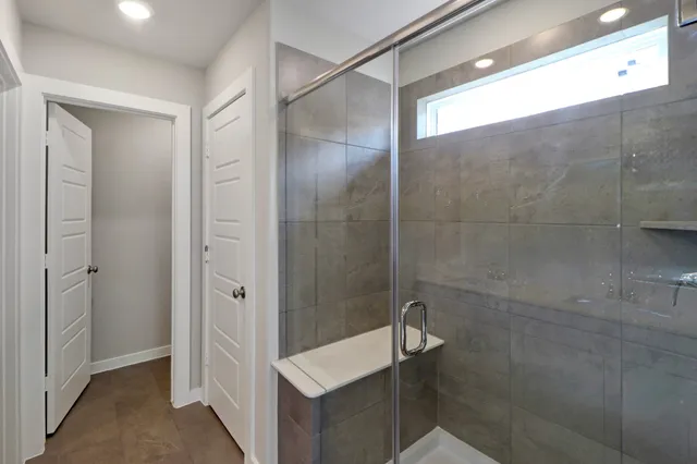 a bathroom with a shower and a sink