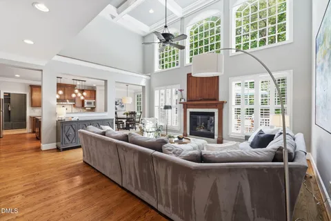 a kitchen with kitchen island granite countertop a sink and refrigerator