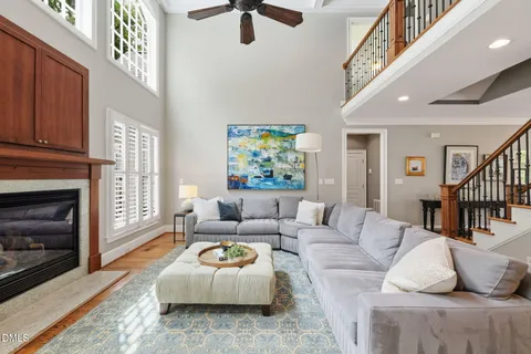 a kitchen with stainless steel appliances granite countertop a refrigerator a stove and a sink with wooden cabinets