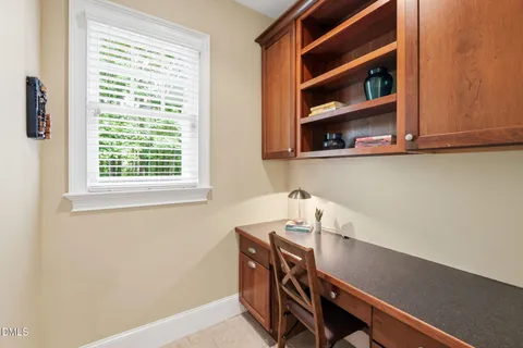 a view of a room with window and ceiling fan
