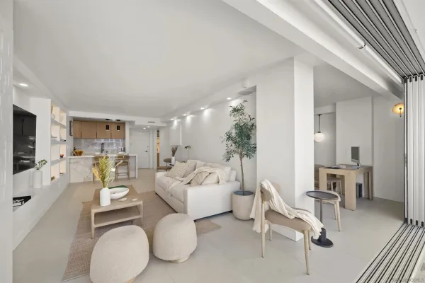a living room with furniture and a large window
