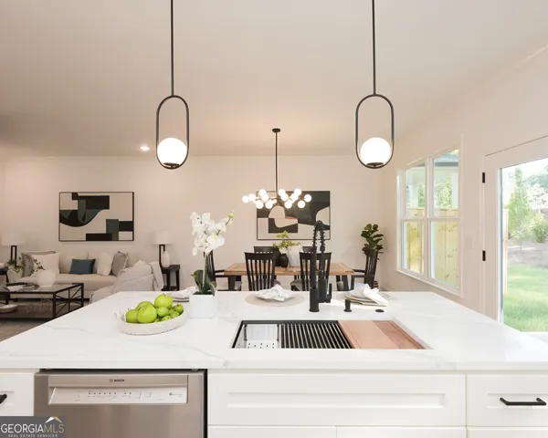 a kitchen with cabinets stainless steel appliances and a counter space