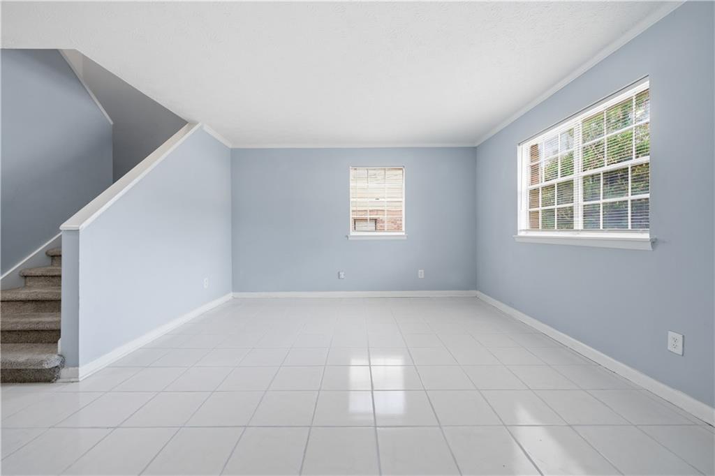 936 6 Oaks Circle, Unit B Norcross, GA 30093 - Photo 18 of 26 a view of an empty room with a window