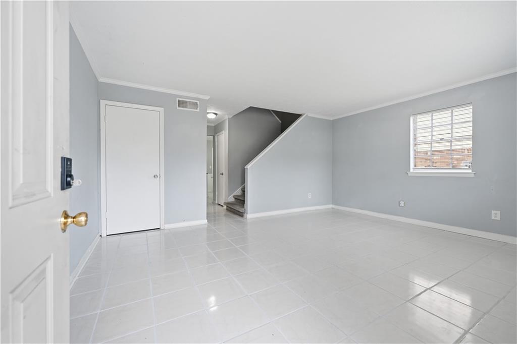 936 6 Oaks Circle, Unit B Norcross, GA 30093 - Photo 19 of 26 an empty room with windows and closet