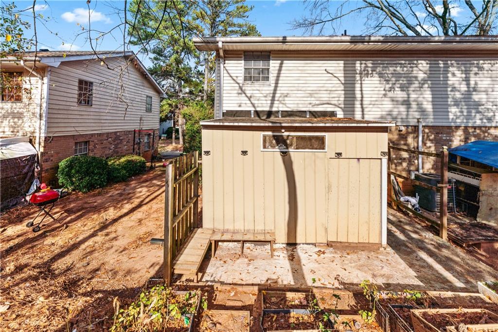 936 6 Oaks Circle, Unit B Norcross, GA 30093 - Photo 23 of 26 a view of a house with a floor to ceiling window and wooden fence