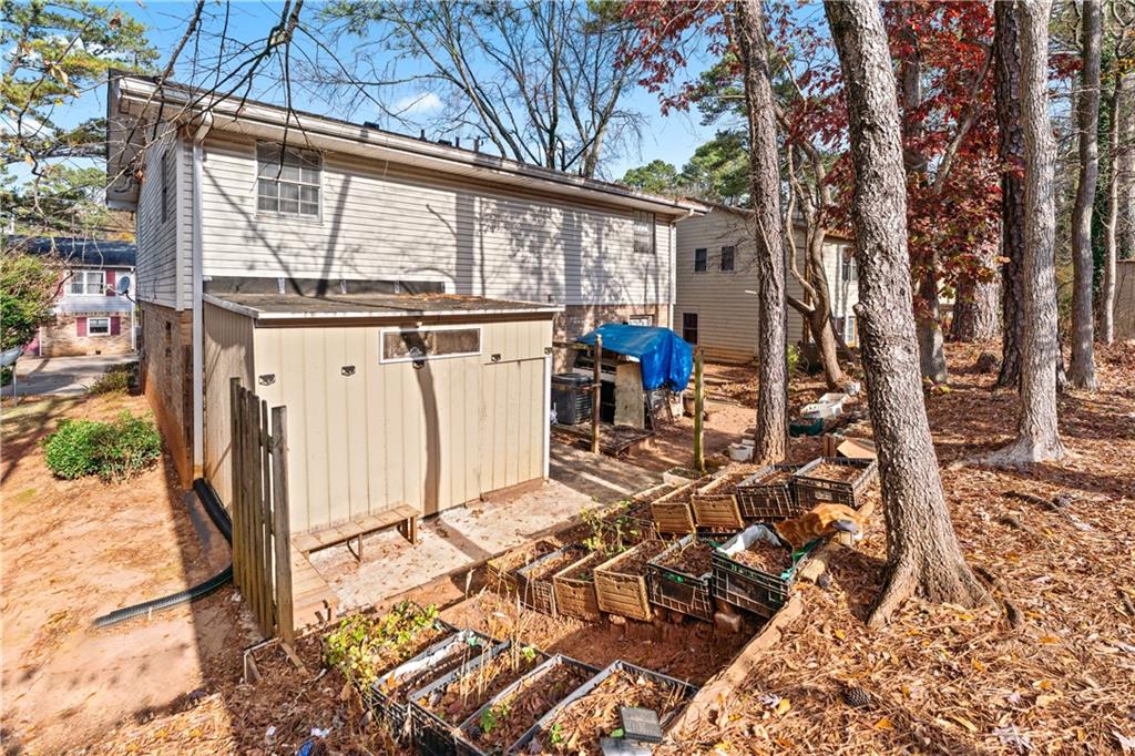 936 6 Oaks Circle, Unit B Norcross, GA 30093 - Photo 25 of 26 a view of a patio with table and chairs and wooden floor