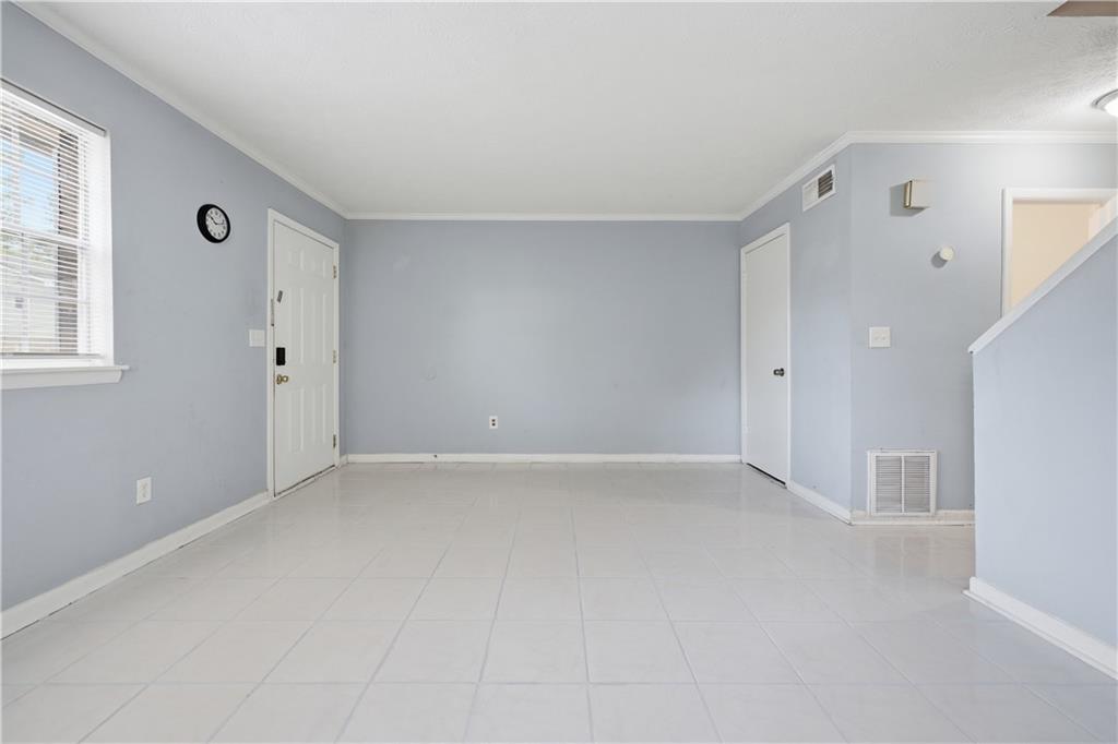 936 6 Oaks Circle, Unit B Norcross, GA 30093 - Photo 4 of 26 a view of an empty room with a window