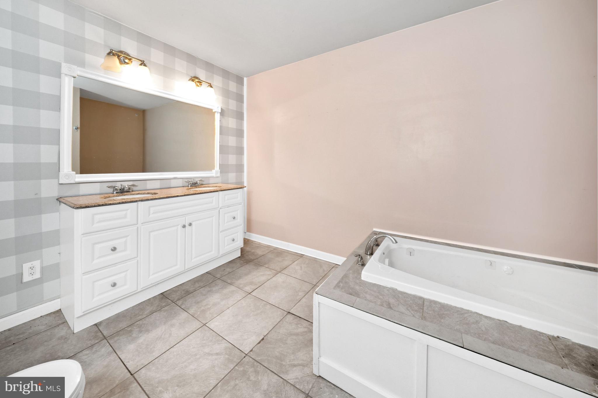 198 Cayots Corner Road Chesapeake City, MD 21915 - Photo 12 of 22 a bathroom with a sink and mirror