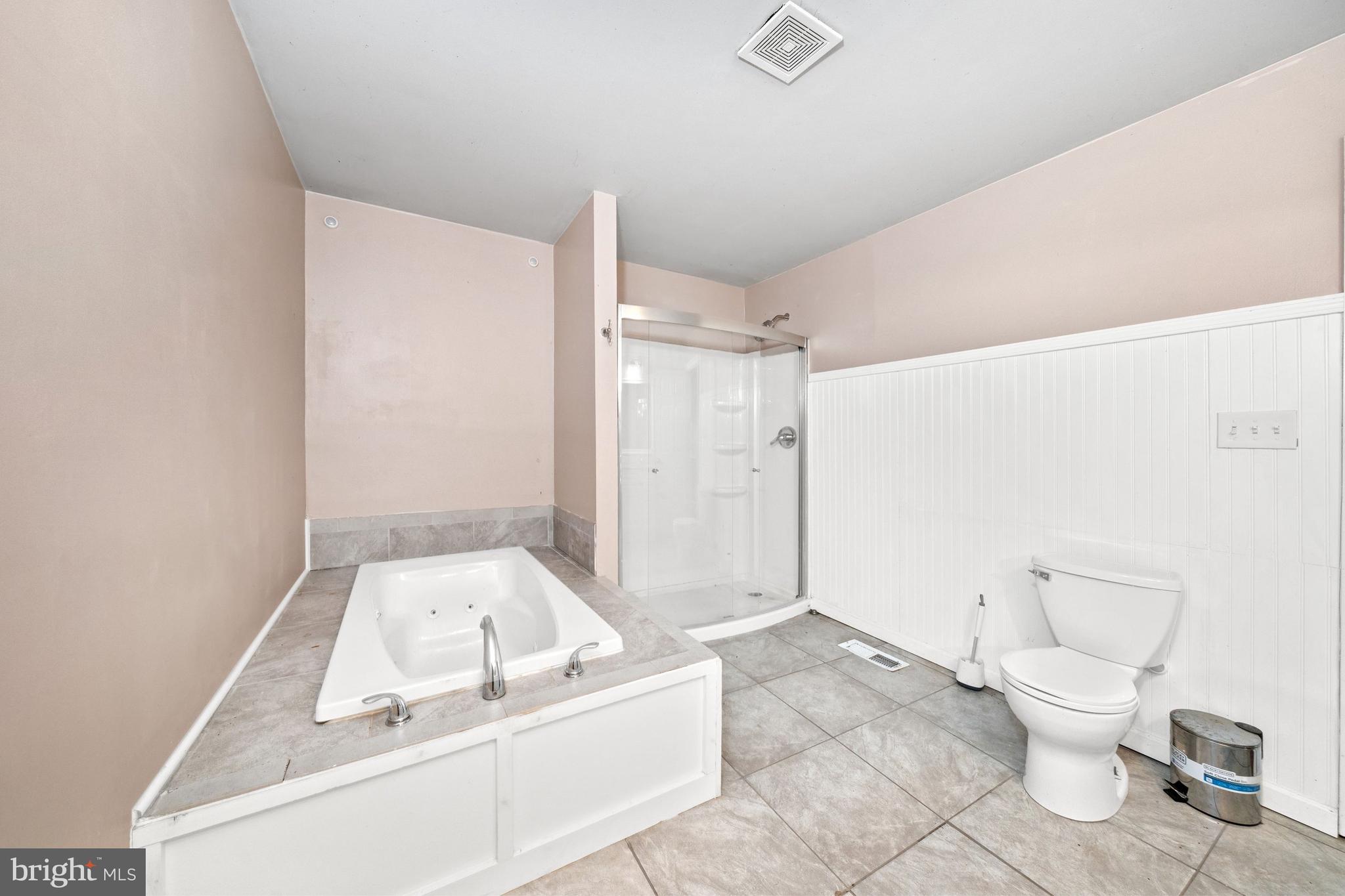 198 Cayots Corner Road Chesapeake City, MD 21915 - Photo 13 of 22 a bathroom with a tub toilet and a shower