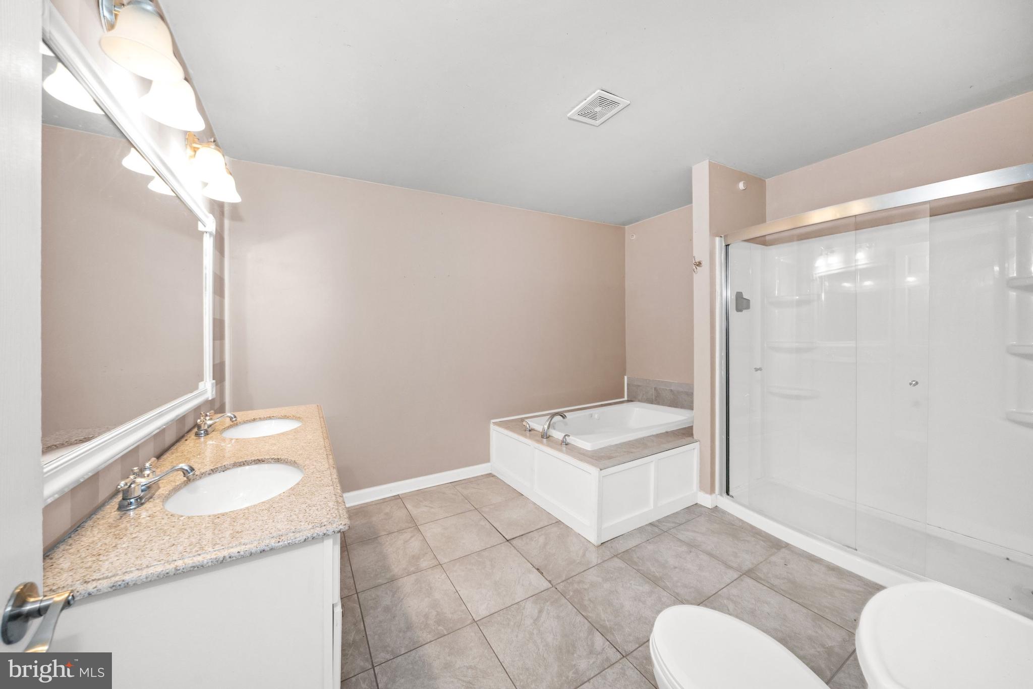 198 Cayots Corner Road Chesapeake City, MD 21915 - Photo 14 of 22 a bathroom with a sink toilet and shower