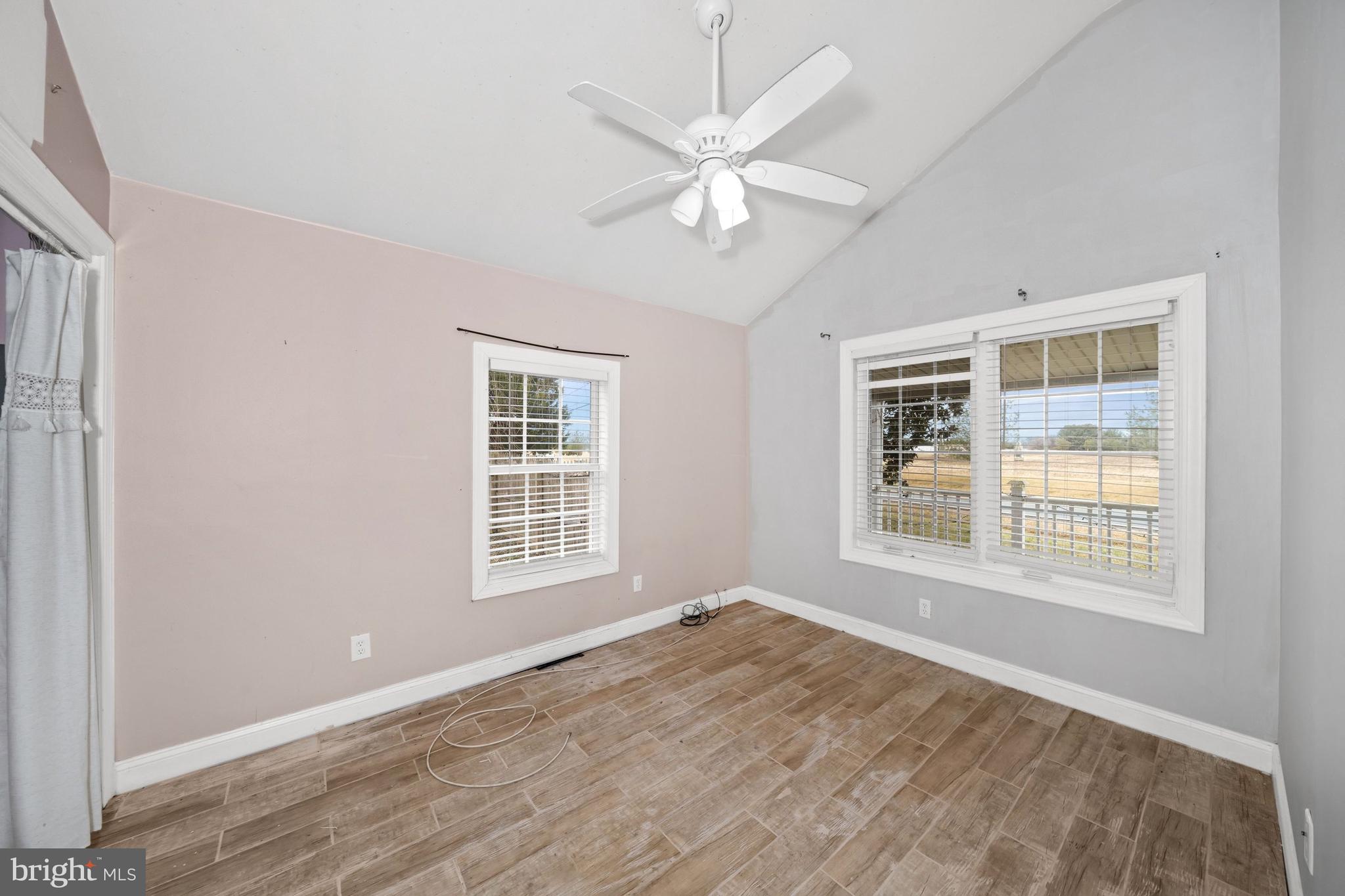 198 Cayots Corner Road Chesapeake City, MD 21915 - Photo 18 of 22 a view of an empty room with a window and wooden floor