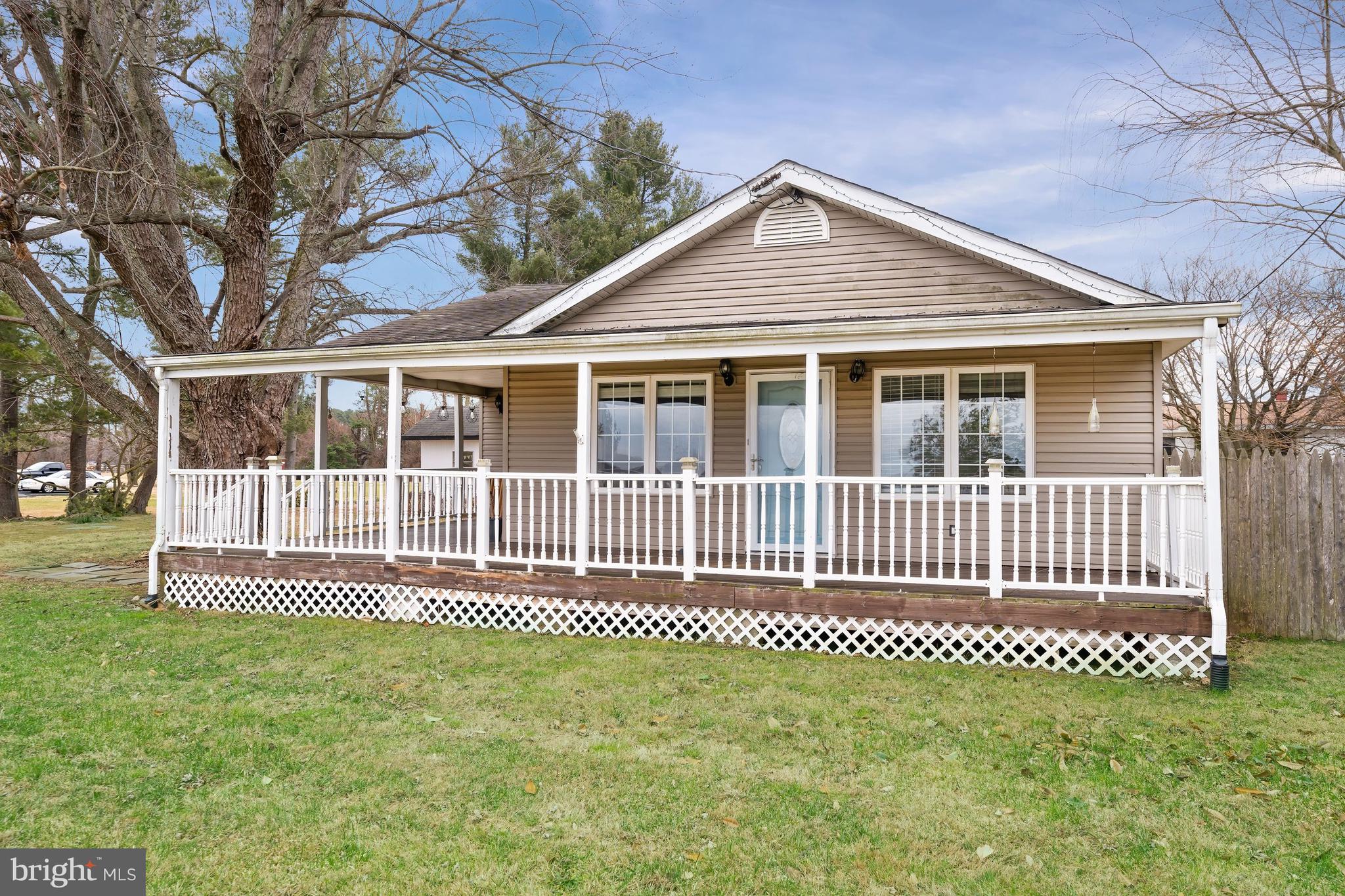 198 Cayots Corner Road Chesapeake City, MD 21915 - Photo 3 of 22 a front view of a house with a garden
