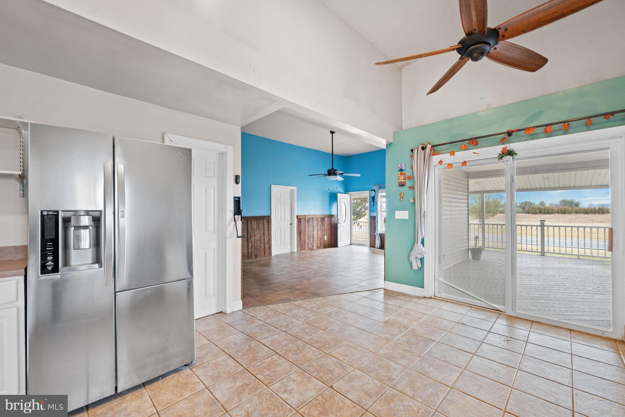 198 Cayots Corner Road Chesapeake City, MD 21915 - Photo 10 of 22 a view of a refrigerator in kitchen and an empty room
