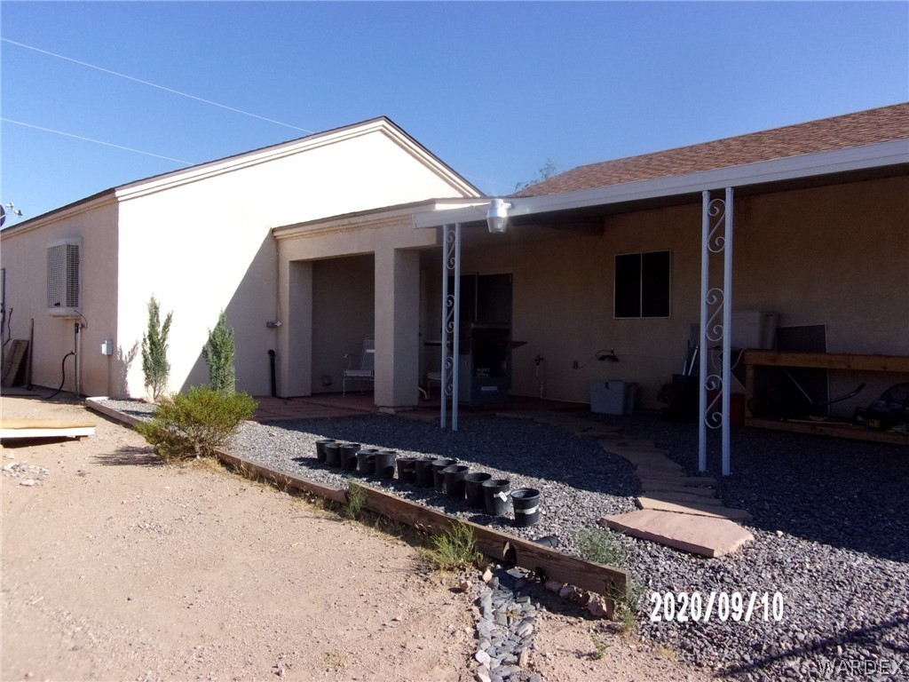 303 Bouse Road Golden Valley, AZ 86413 - Photo 11 of 42 a view of a house with a yard