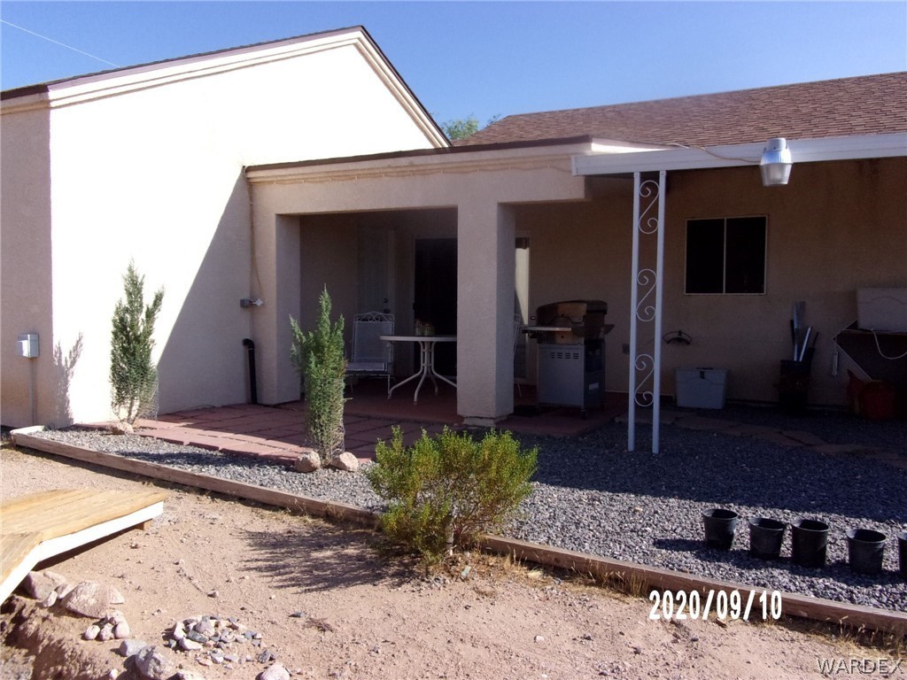 303 Bouse Road Golden Valley, AZ 86413 - Photo 12 of 42 a view of a entryway door front of house