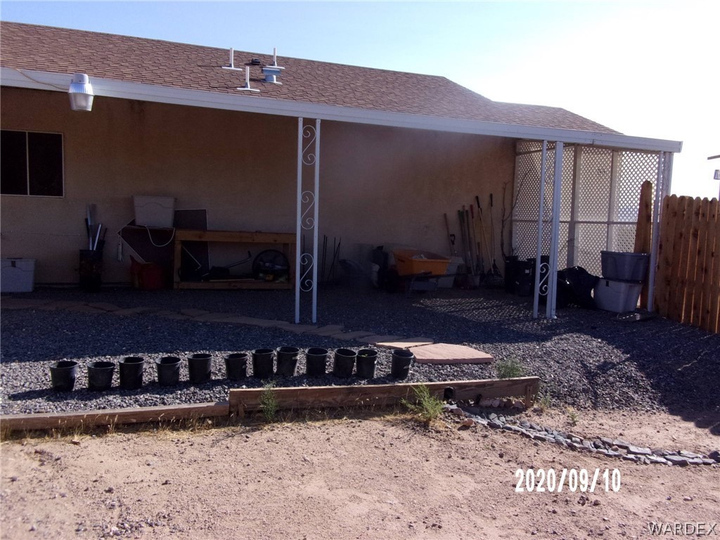 303 Bouse Road Golden Valley, AZ 86413 - Photo 13 of 42 a view of a house with backyard