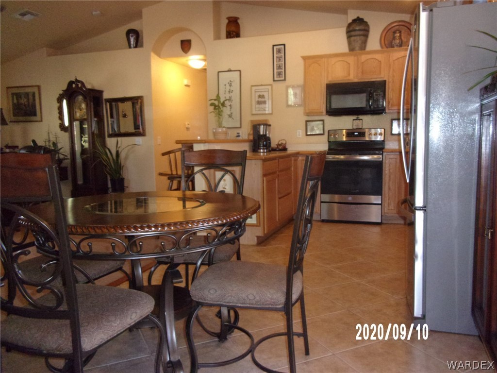 303 Bouse Road Golden Valley, AZ 86413 - Photo 17 of 42 a view of a dining room with furniture